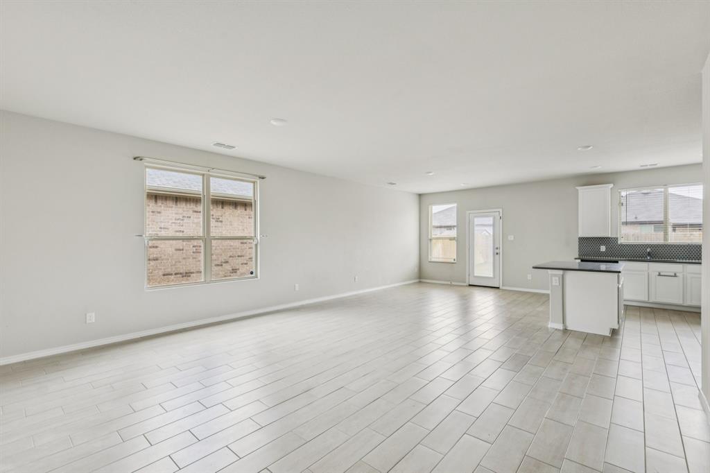 969 Ravenwood Lane Van Alstyne, TX 75495 - Photo 3 of 27 a view of an empty room with a window