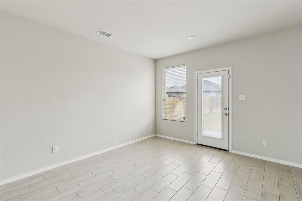 969 Ravenwood Lane Van Alstyne, TX 75495 - Photo 7 of 27 an empty room with windows