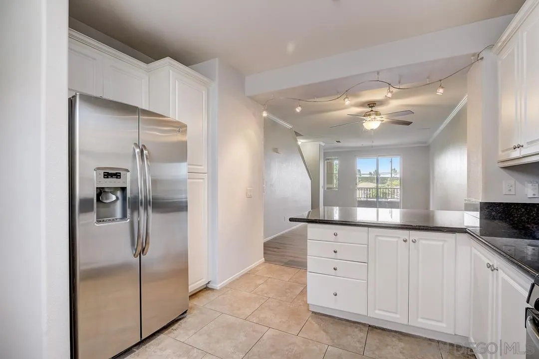 10225 Daybreak Lane, Unit 2 Santee, CA 92071 - Photo 11 of 20 a large kitchen with a refrigerator and a sink