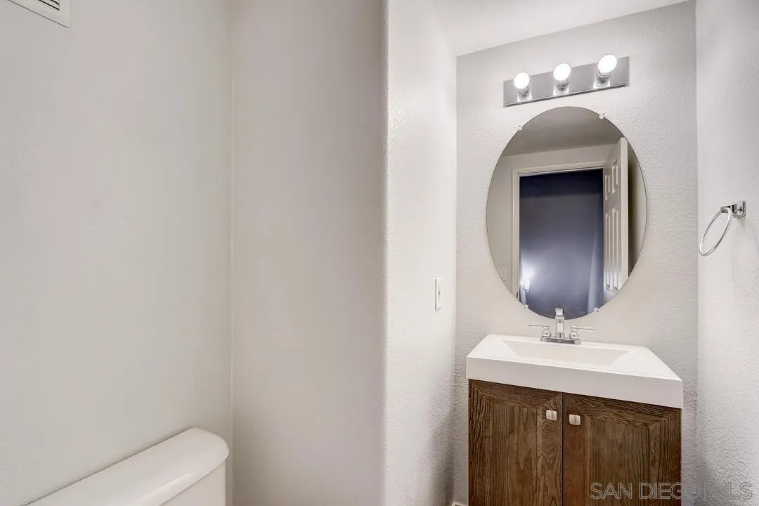 10225 Daybreak Lane, Unit 2 Santee, CA 92071 - Photo 17 of 20 a bathroom with a sink and a mirror