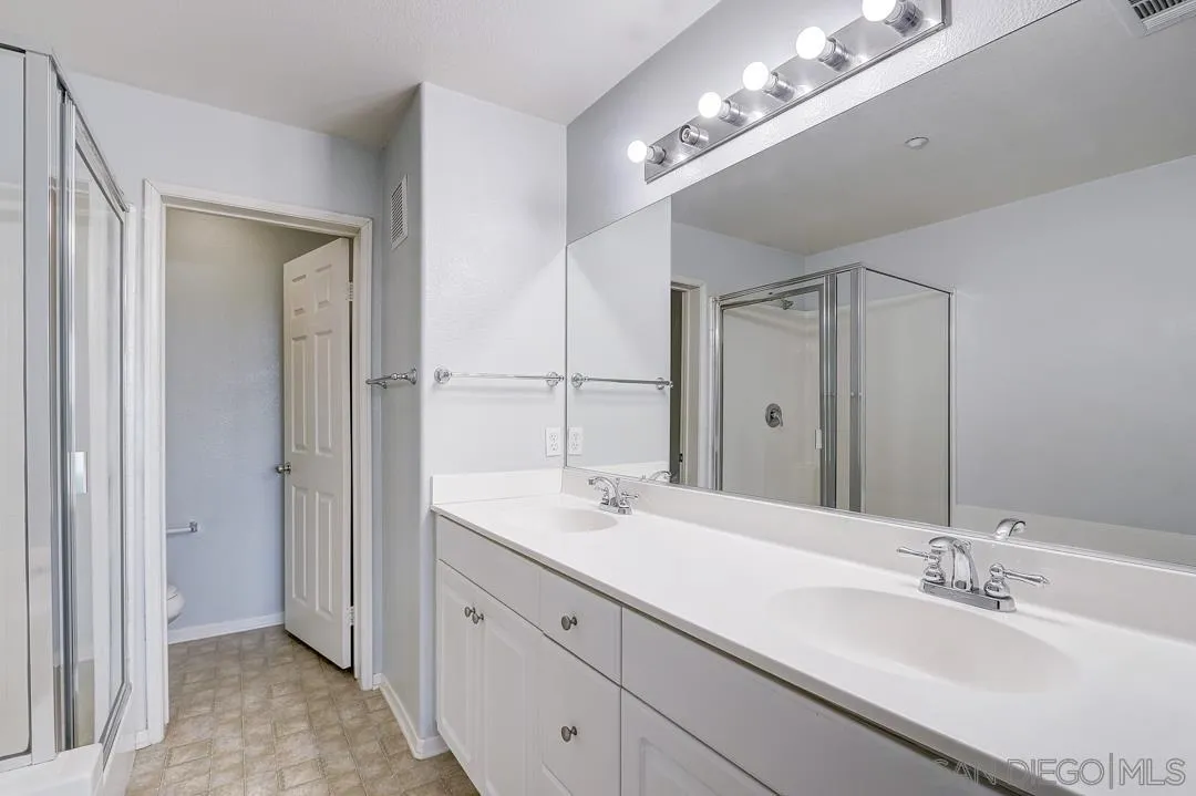 10225 Daybreak Lane, Unit 2 Santee, CA 92071 - Photo 7 of 20 a bathroom with double vanity sinks and a mirror