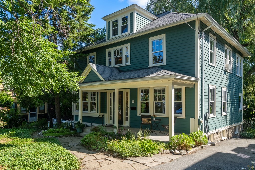 98 Hillside Avenue Arlington, MA 02476 - Photo 1 of 36 a front view of a house with garden