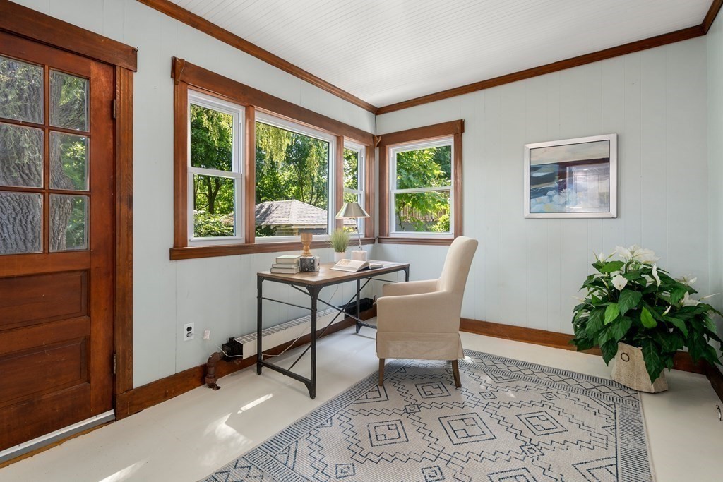 98 Hillside Avenue Arlington, MA 02476 - Photo 15 of 36 a workspace room with furniture and a potted plant