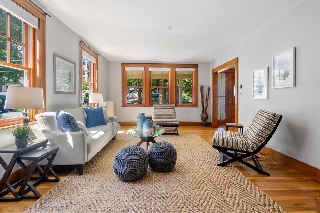 98 Hillside Avenue Arlington, MA 02476 - Photo 17 of 36 a living room with furniture and a large window