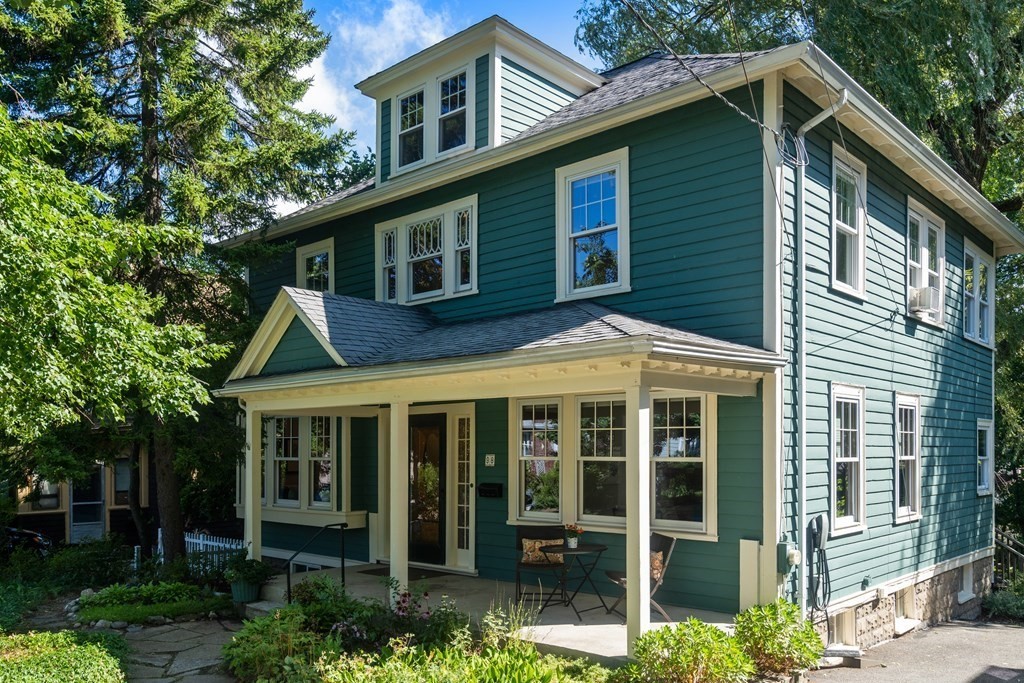 98 Hillside Avenue Arlington, MA 02476 - Photo 2 of 36 a front view of a house with a yard
