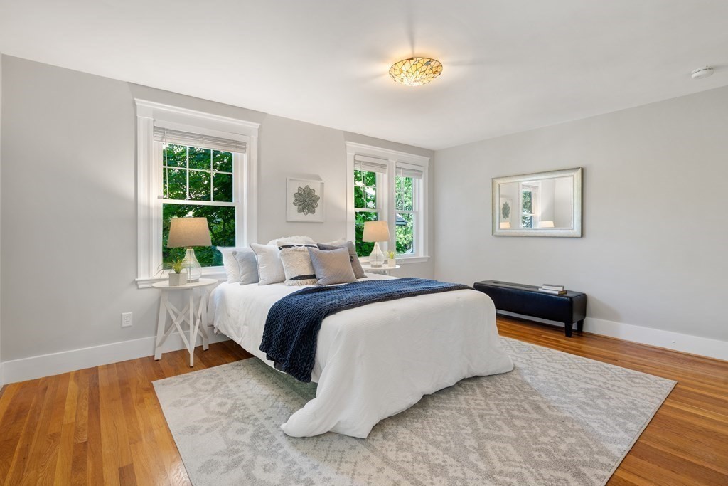 98 Hillside Avenue Arlington, MA 02476 - Photo 21 of 36 a bedroom with a bed and a couch