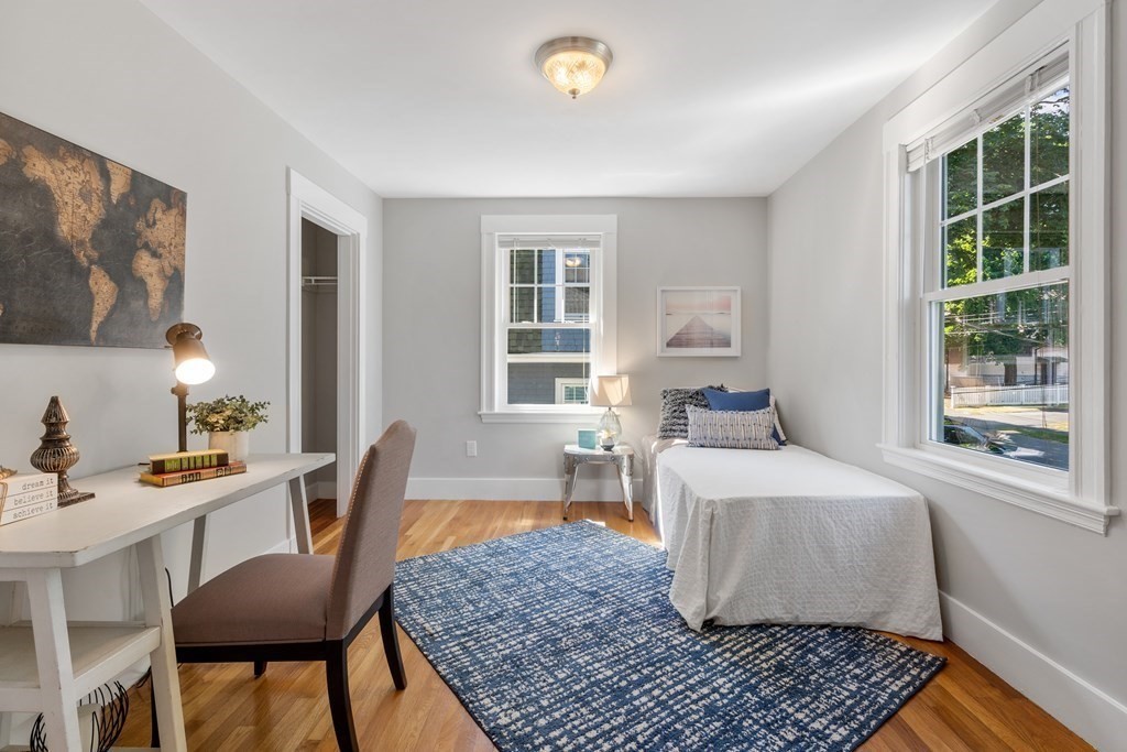 98 Hillside Avenue Arlington, MA 02476 - Photo 22 of 36 a bedroom with a bed and wooden floor