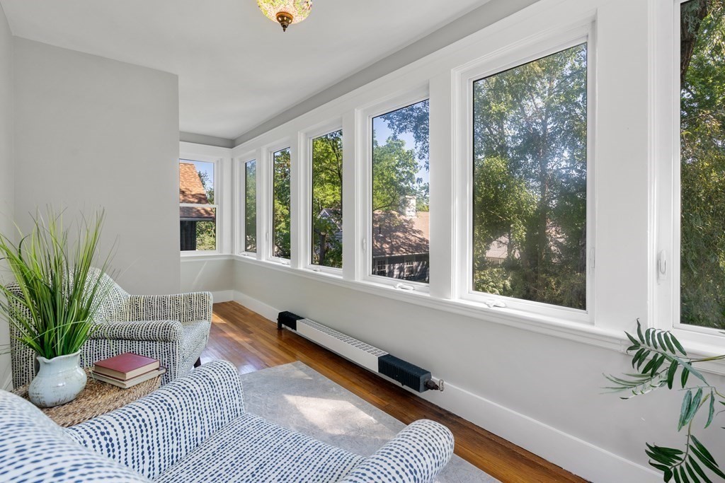 98 Hillside Avenue Arlington, MA 02476 - Photo 25 of 36 a living room with furniture and a potted plant