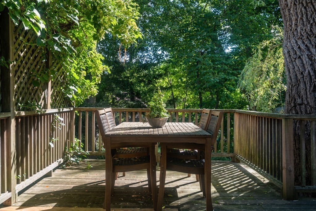 98 Hillside Avenue Arlington, MA 02476 - Photo 30 of 36 a balcony with wooden floor table and chairs