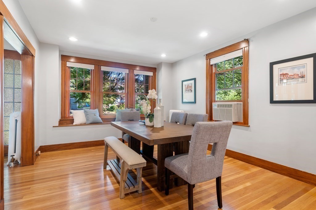 98 Hillside Avenue Arlington, MA 02476 - Photo 8 of 36 a view of a dining room with furniture window and wooden floor