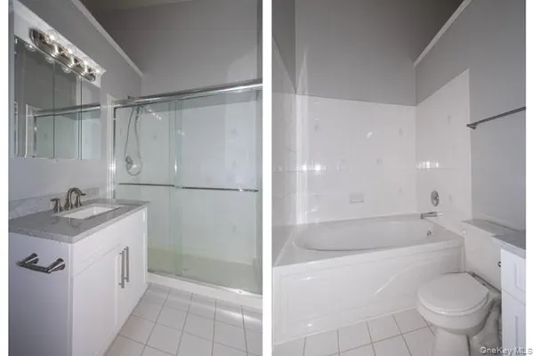 a bathroom with a granite countertop sink a toilet and shower