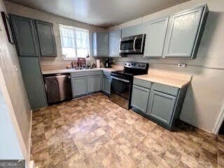 601 Heard Augusta, GA 30904 - Photo 12 of 51 a kitchen with a sink stove and refrigerator