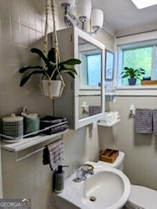 601 Heard Augusta, GA 30904 - Photo 18 of 51 a bathroom with a sink a window and potted plant