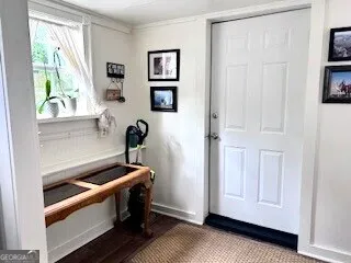 a backyard of a house with table and chairs