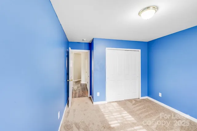a bathroom with a tub a sink and a large mirror