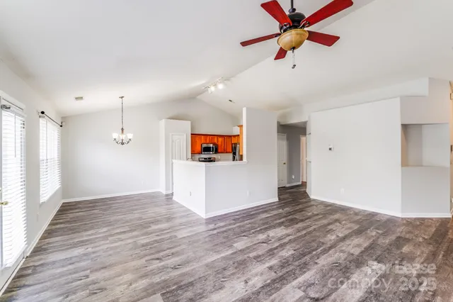 a view of empty room with a fireplace