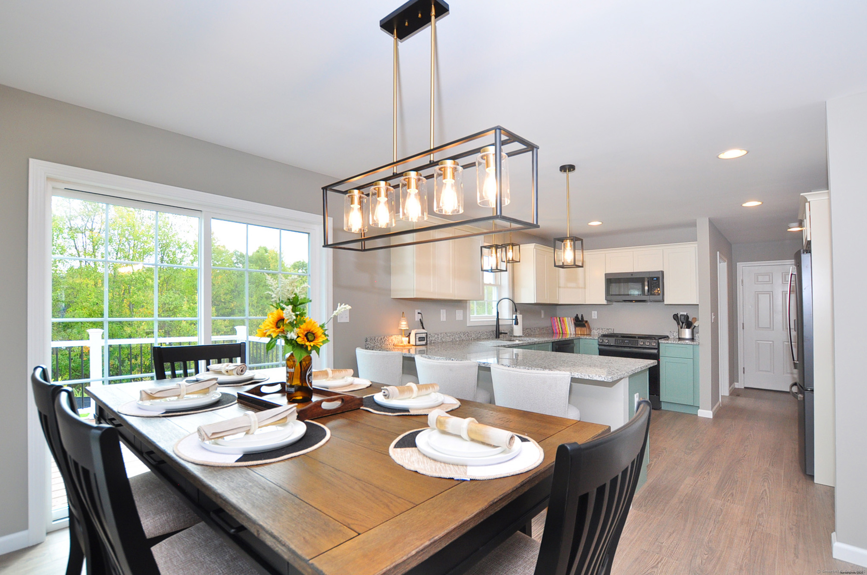 34 West River Road East Windsor, CT 06088 - Photo 10 of 31 a open dining room with furniture a chandelier and wooden floor