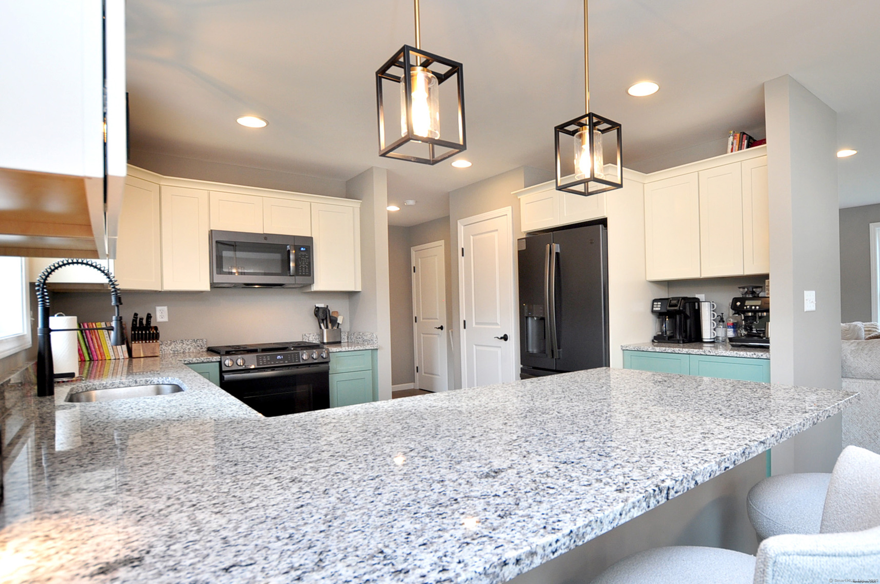 34 West River Road East Windsor, CT 06088 - Photo 13 of 31 a kitchen with stainless steel appliances granite countertop a sink stove and refrigerator