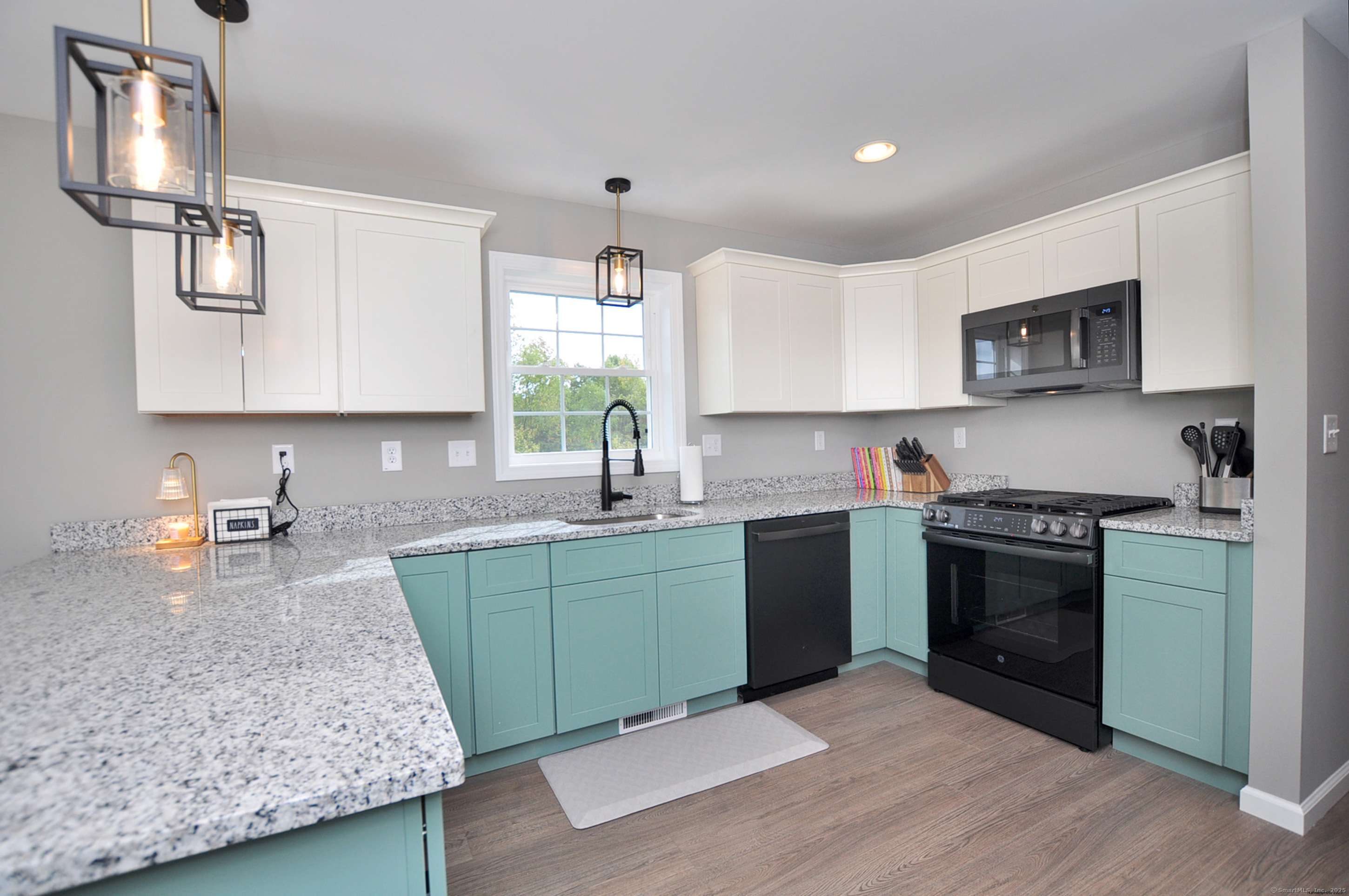 34 West River Road East Windsor, CT 06088 - Photo 15 of 31 a kitchen with granite countertop a sink stainless steel appliances and cabinets