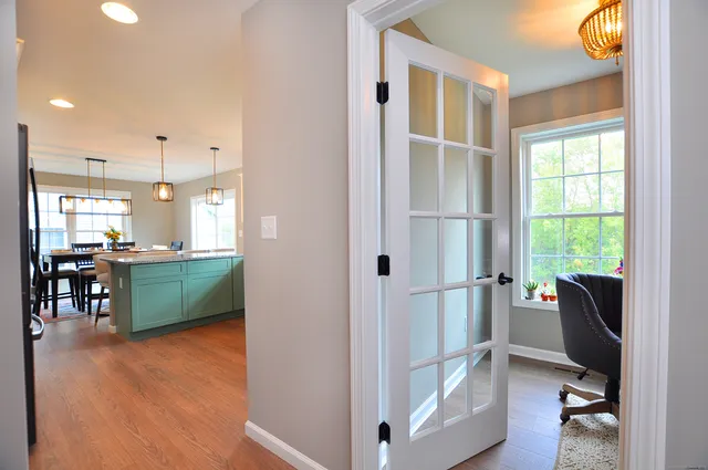 a kitchen with sink and cabinets