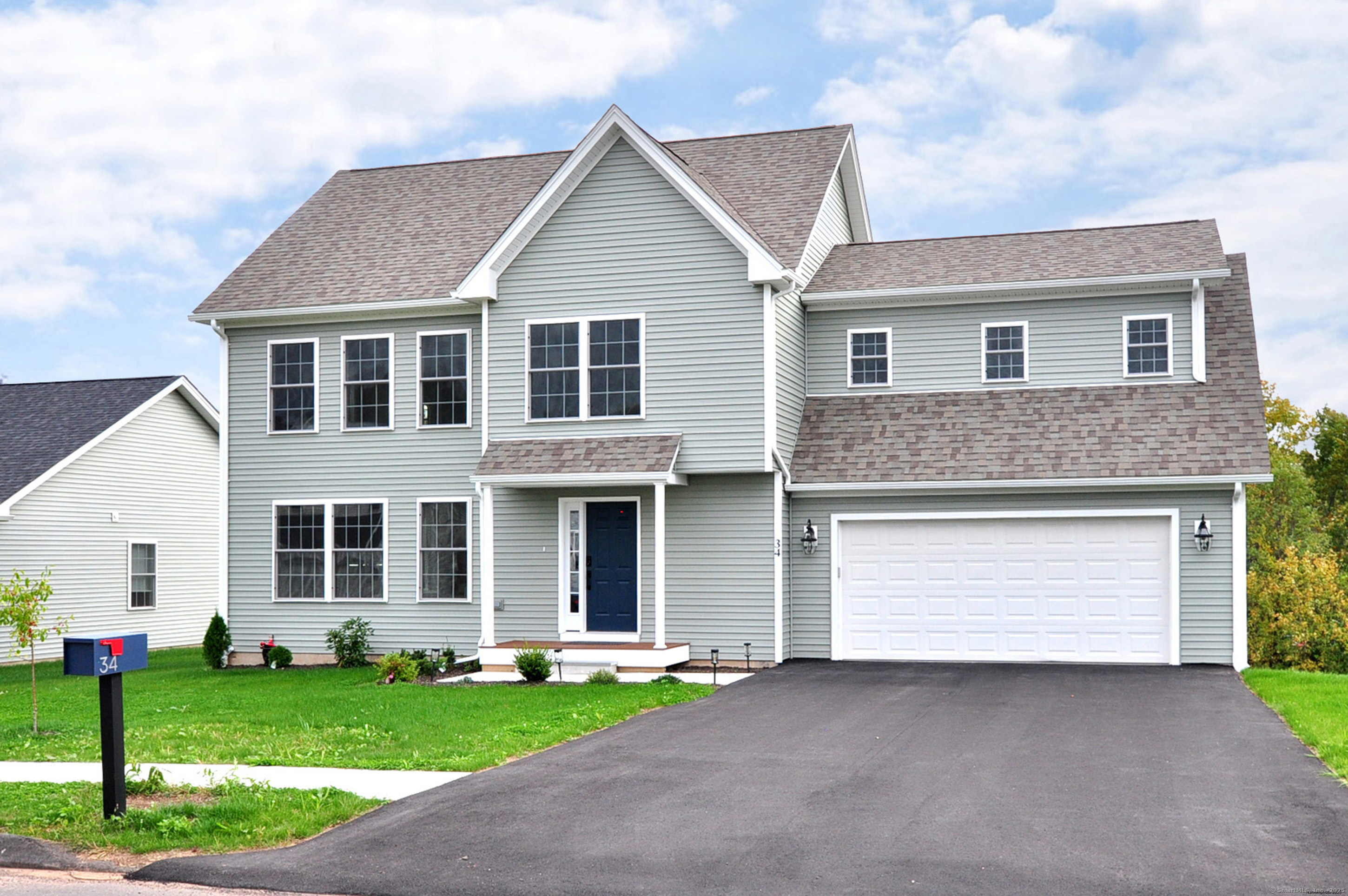 34 West River Road East Windsor, CT 06088 - Photo 2 of 31 a front view of a house with a garden and yard