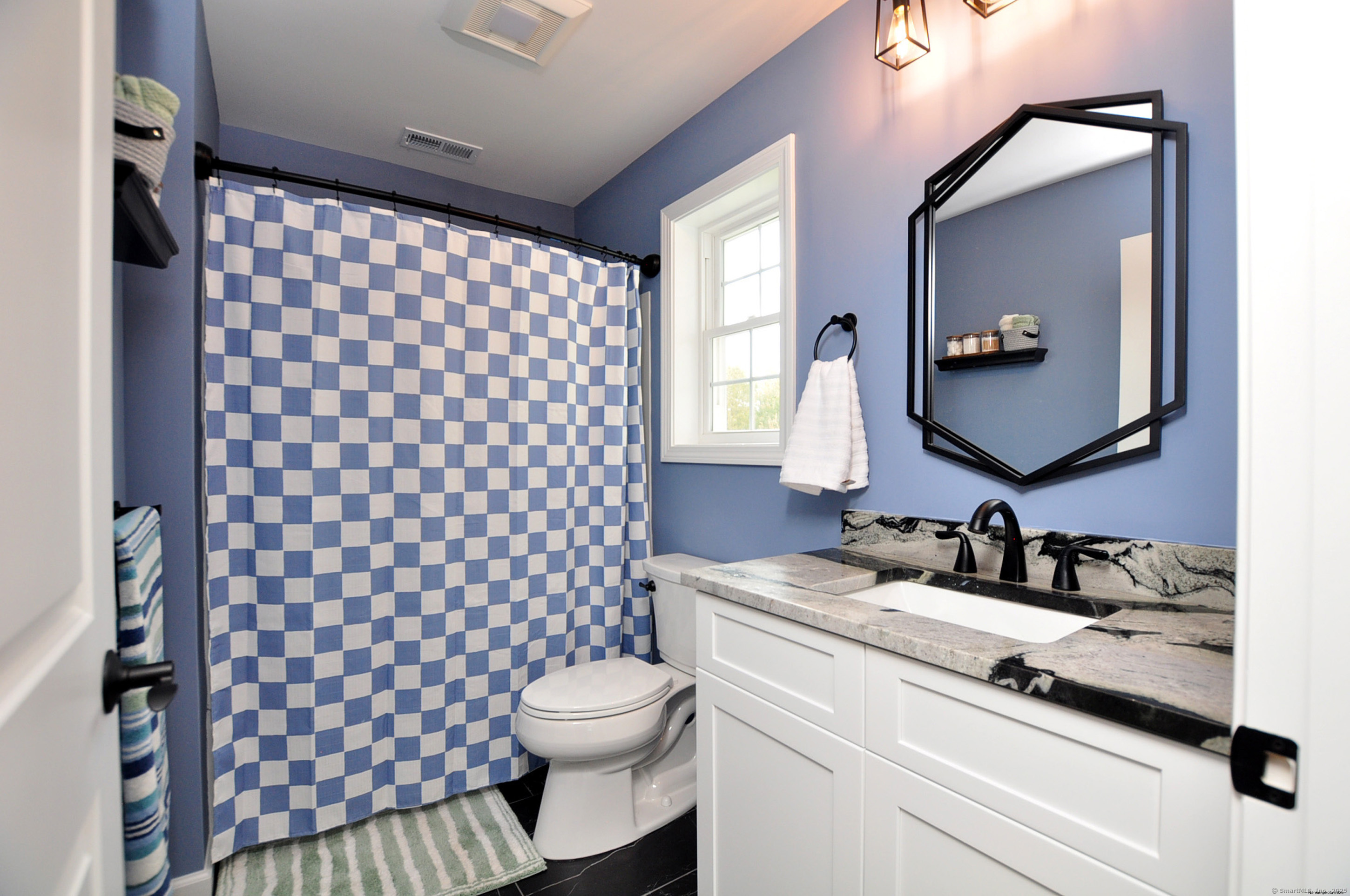 34 West River Road East Windsor, CT 06088 - Photo 25 of 31 a bathroom with a sink vanity mirror and toilet