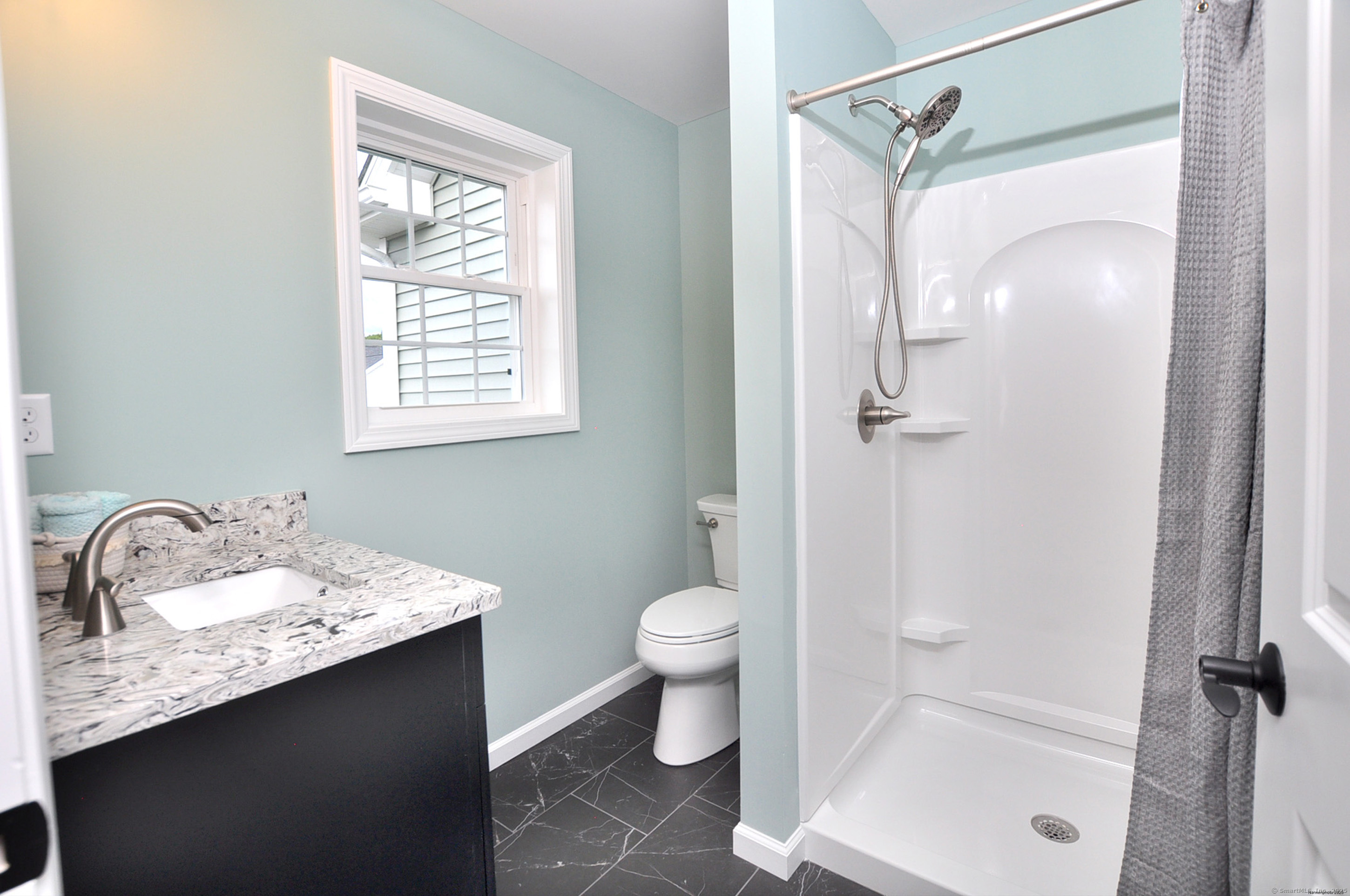 34 West River Road East Windsor, CT 06088 - Photo 29 of 31 a bathroom with a granite countertop sink toilet and shower