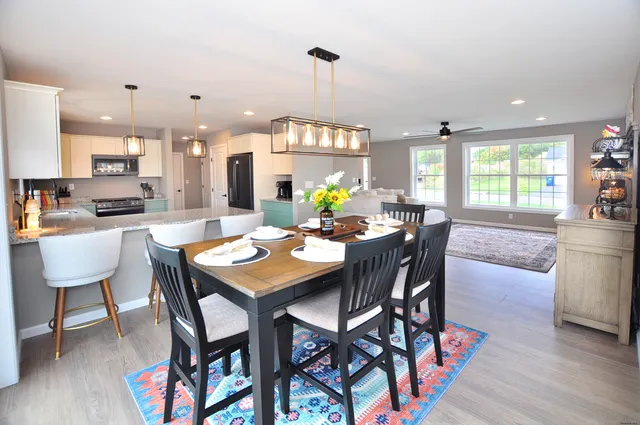 a view of a dining room with furniture window and outside view