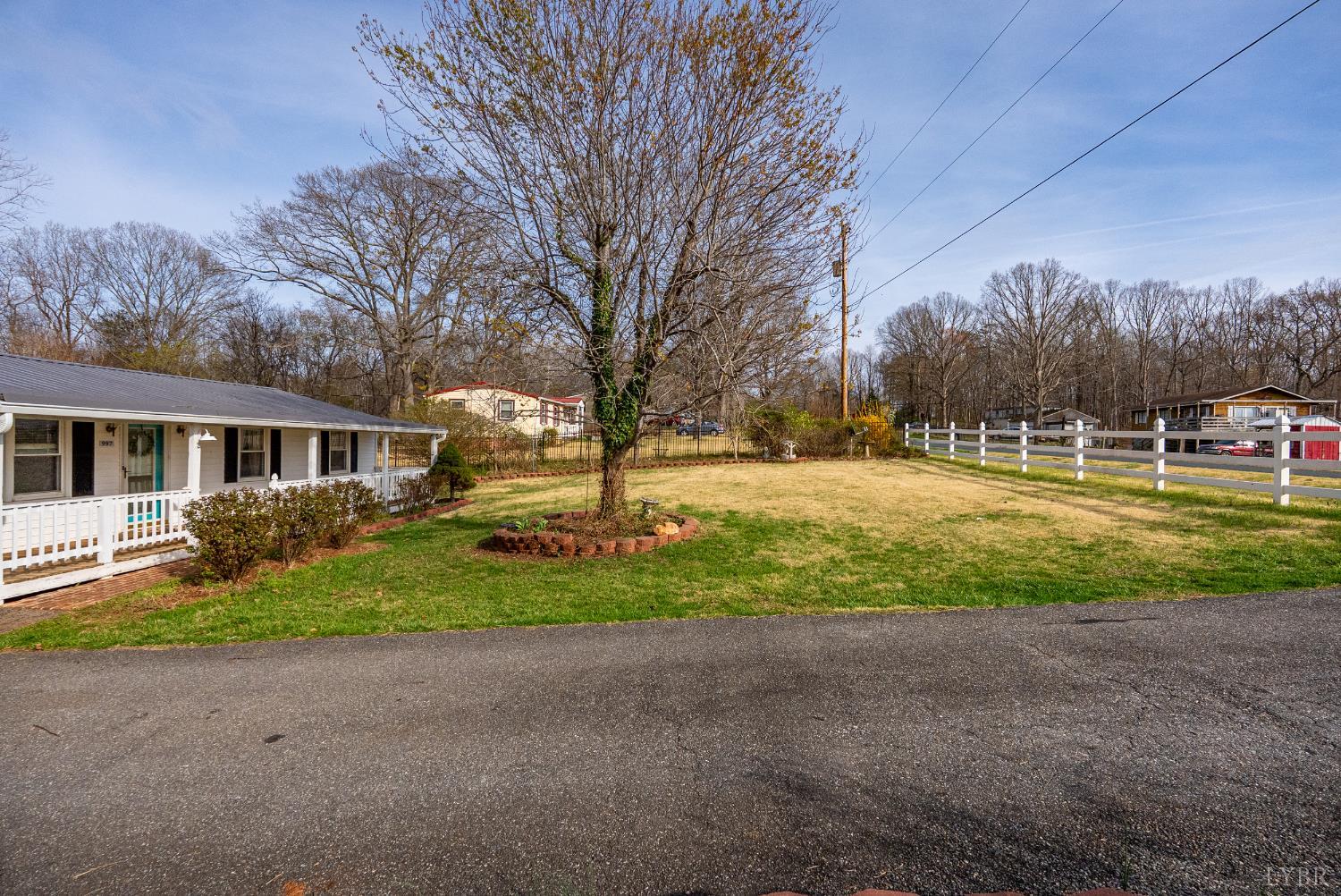 997 Toytown Road Amherst, VA 24521 - Photo 26 of 50 a front view of a house with a yard and trees