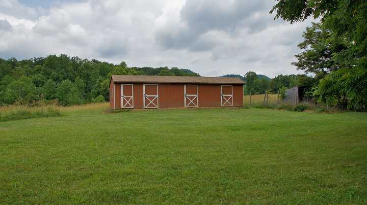 335 Barton Spur Road Ferrum, VA 24088 - Photo 11 of 18 a front view of house with yard and green space