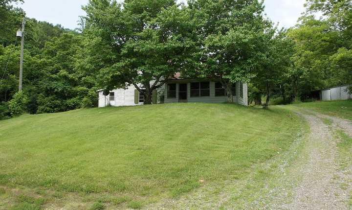 335 Barton Spur Road Ferrum, VA 24088 - Photo 15 of 18 a view of a house with a yard