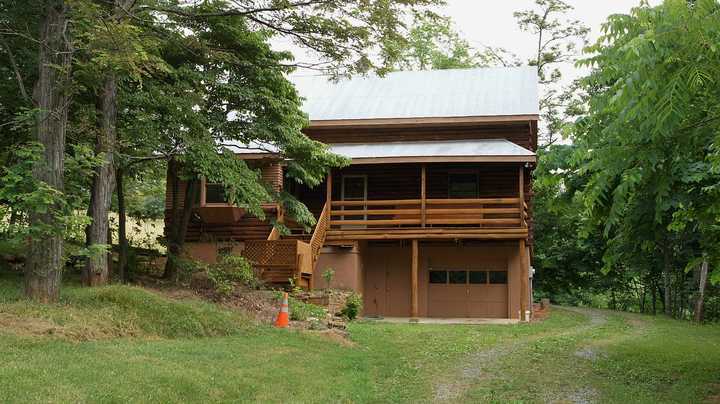 335 Barton Spur Road Ferrum, VA 24088 - Photo 3 of 18 a view of house with backyard and trees