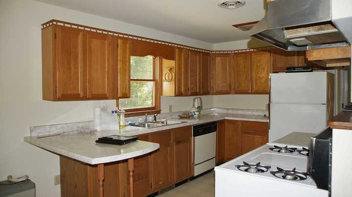 335 Barton Spur Road Ferrum, VA 24088 - Photo 6 of 18 a kitchen with stainless steel appliances granite countertop a sink stove and refrigerator