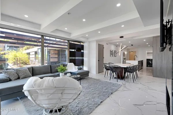 a living room with furniture and a large window