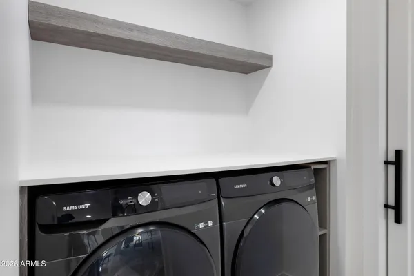 a bedroom with a bed and wall painting