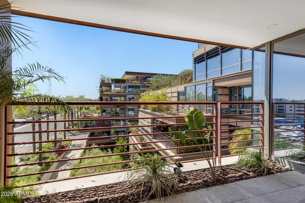 a view of a balcony with a potted plants