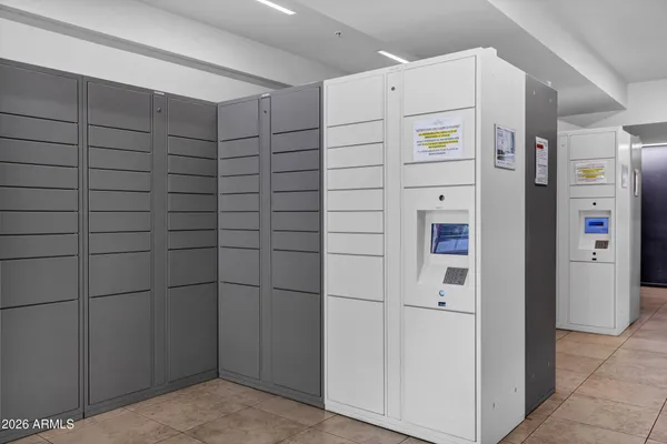 a white refrigerator freezer and a stove sitting inside of a kitchen