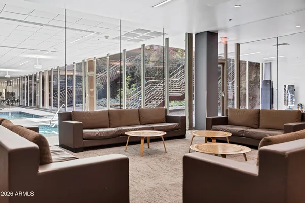 a living room with furniture and a large window