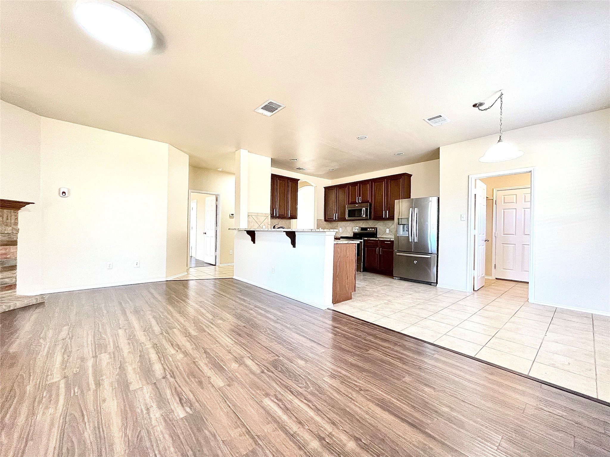 508 Emma Rose Trail Leander, TX 78641 - Photo 40 of 40 An open floorplan seamlessly connects the living area and kitchen, perfect for entertaining.