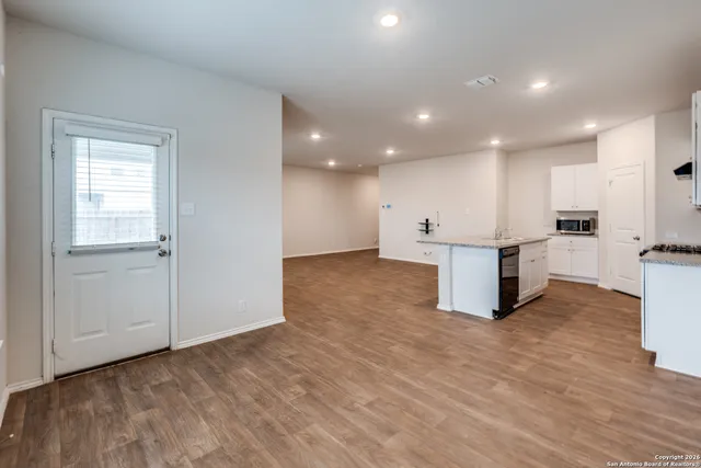 a view of kitchen with wooden floor