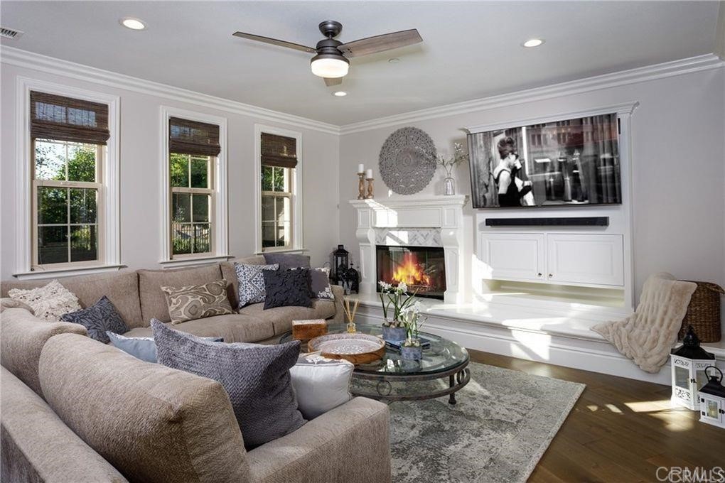 5 David Street Ladera Ranch, CA 92694 - Photo 5 of 22 a living room with furniture and a fireplace