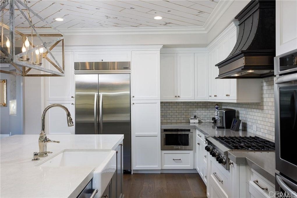 5 David Street Ladera Ranch, CA 92694 - Photo 7 of 22 a kitchen with stainless steel appliances a sink a stove and cabinets