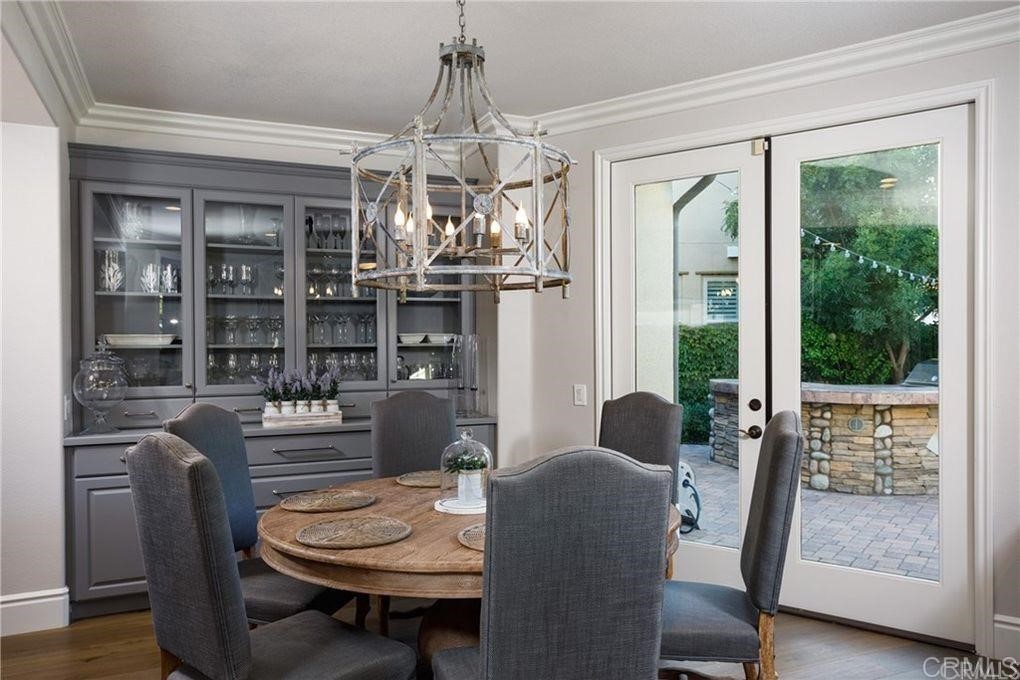 5 David Street Ladera Ranch, CA 92694 - Photo 8 of 22 a dining room with furniture a chandelier and wooden floor