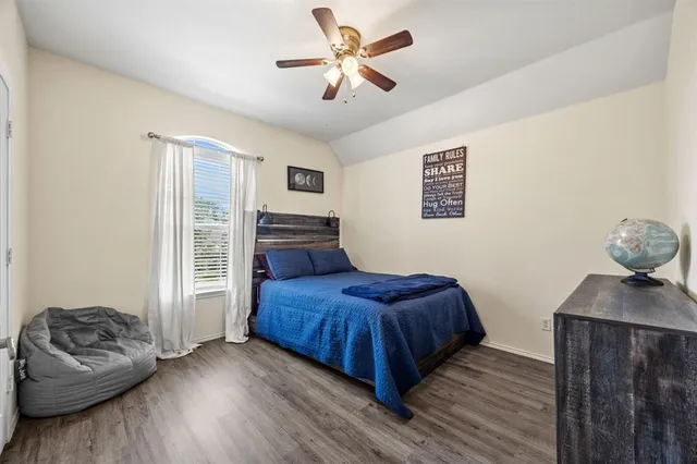 a bedroom with a bed and a couch