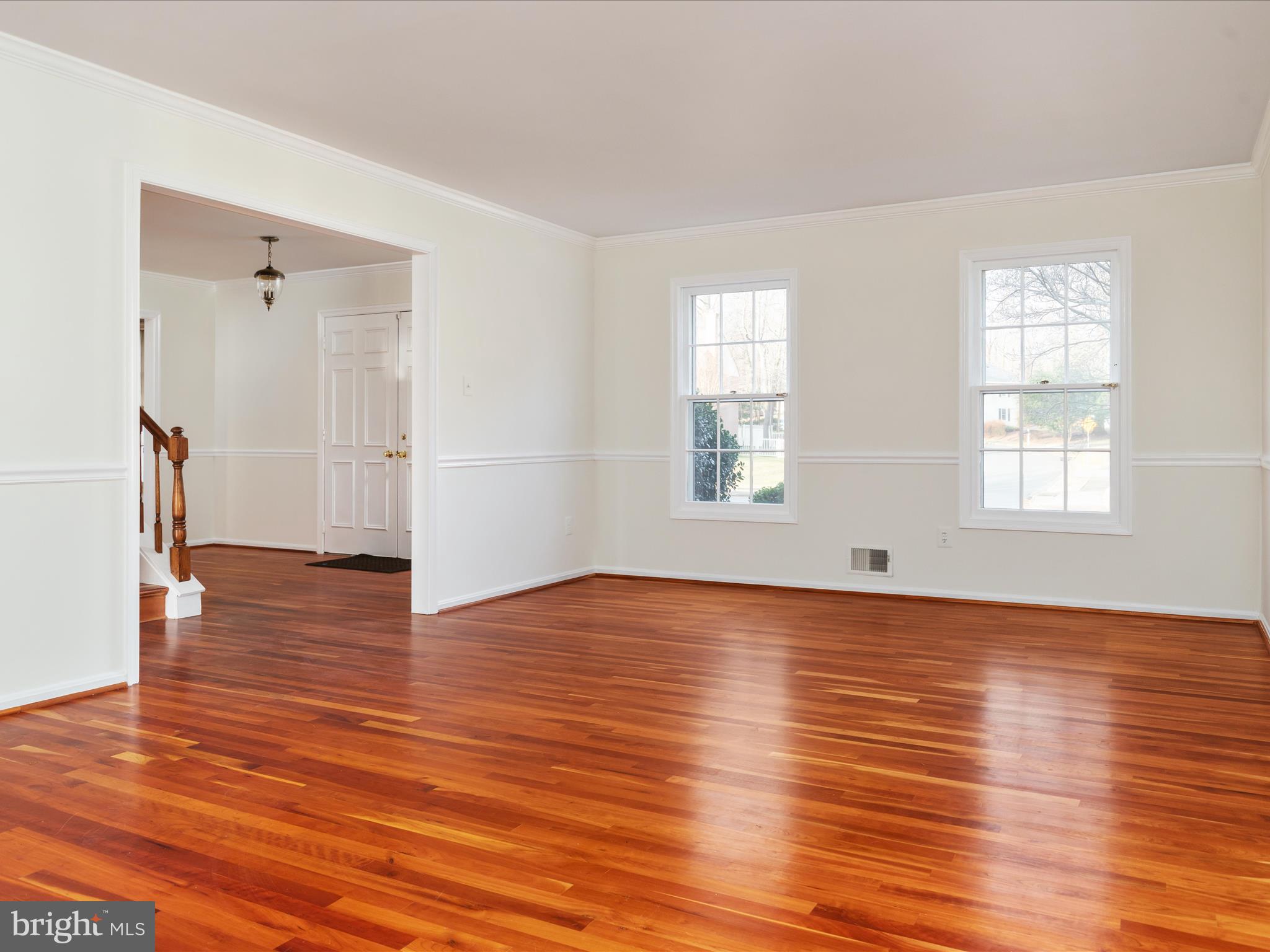 11922 Blue Spruce Road Reston, VA 20191 - Photo 13 of 65 an empty room with wooden floor and windows