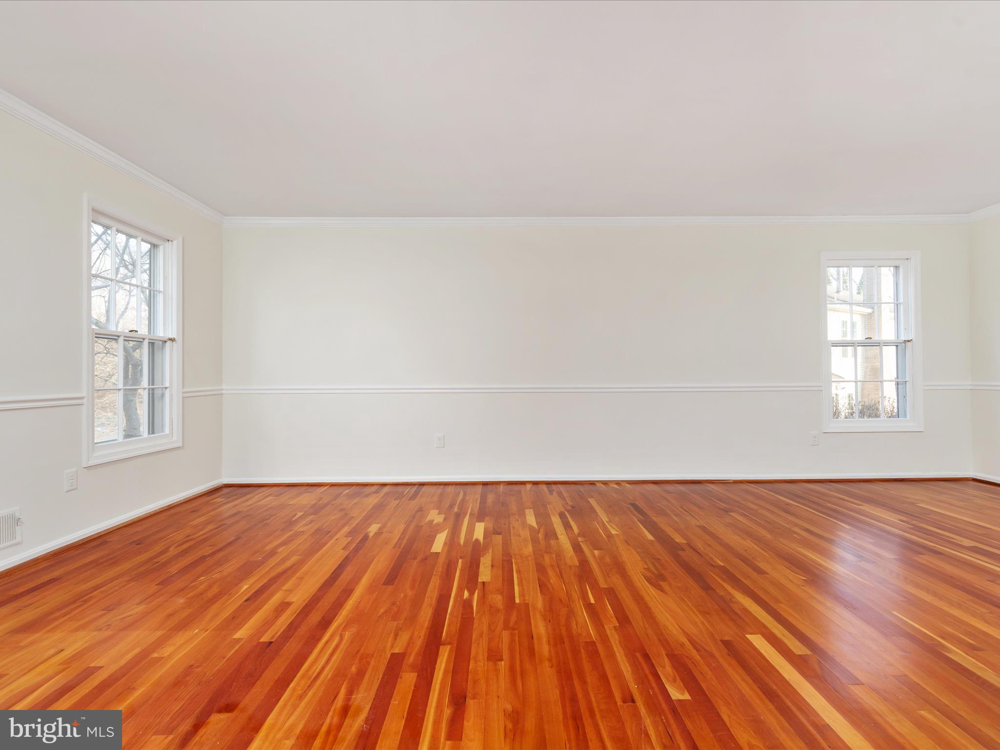 11922 Blue Spruce Road Reston, VA 20191 - Photo 14 of 65 a view of an empty room with wooden floor and window