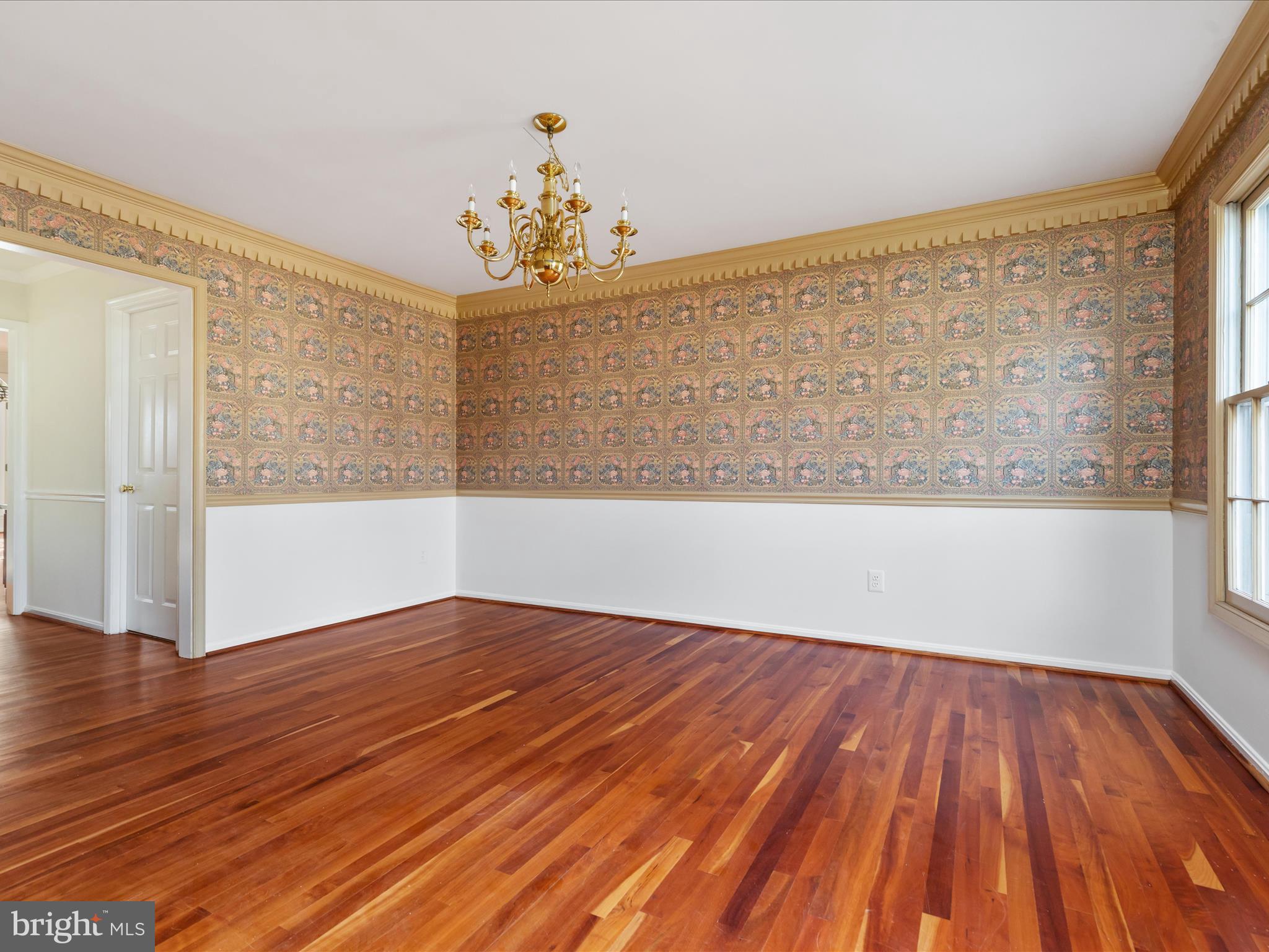 11922 Blue Spruce Road Reston, VA 20191 - Photo 15 of 65 a view of an empty room with wooden floor and a window