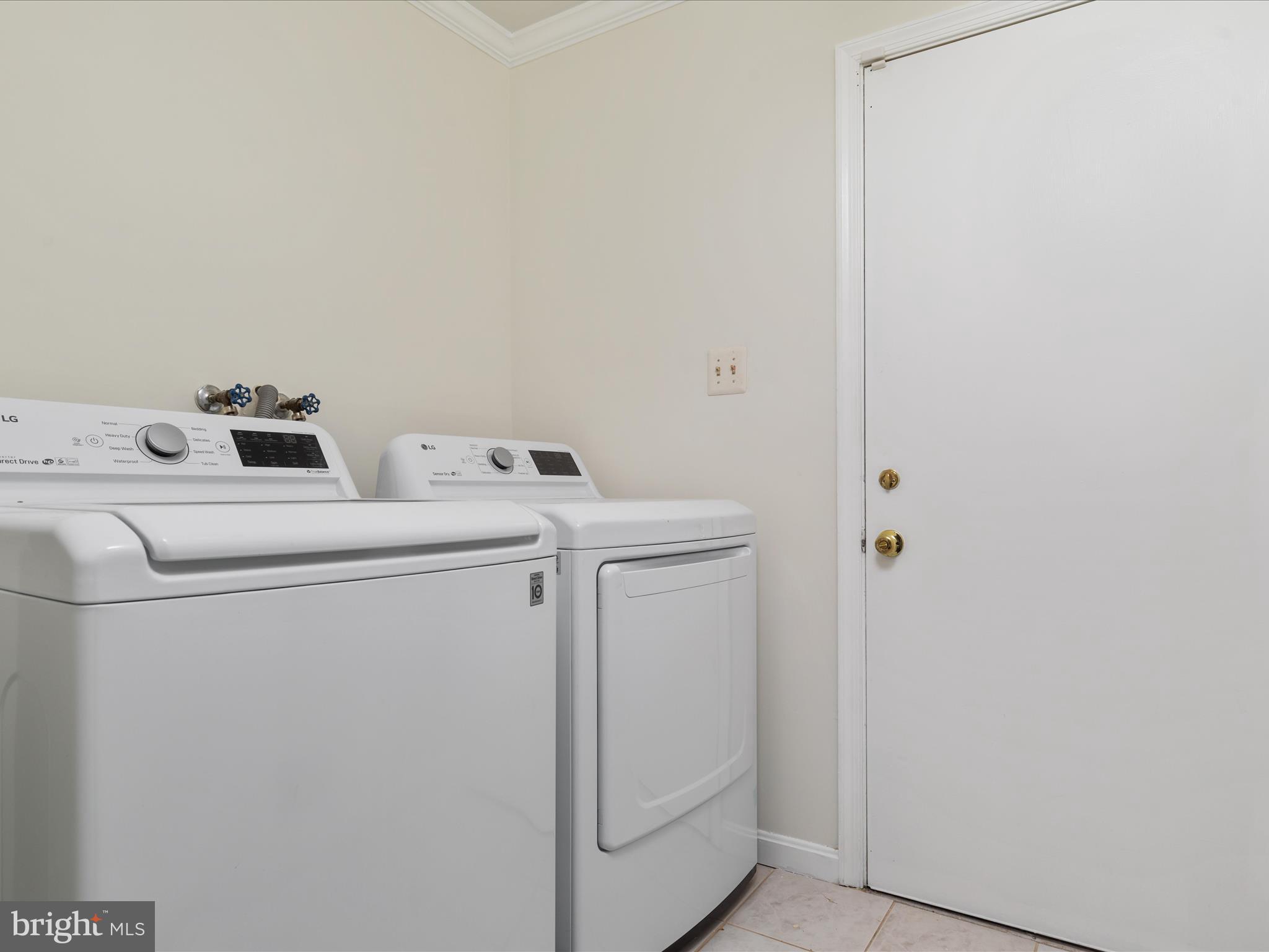 11922 Blue Spruce Road Reston, VA 20191 - Photo 17 of 65 a utility room with dryer and washer