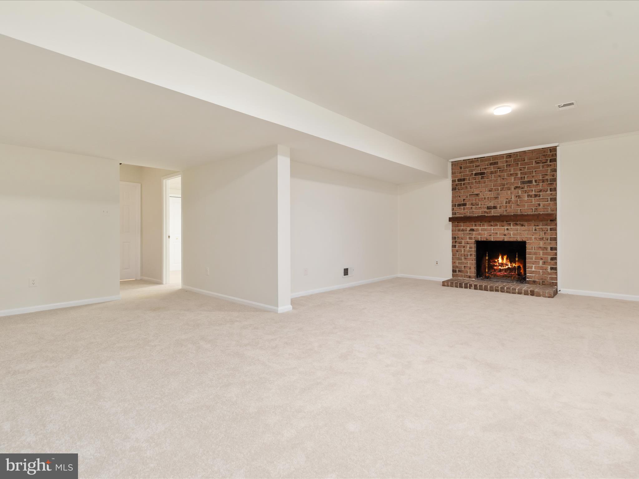 11922 Blue Spruce Road Reston, VA 20191 - Photo 31 of 65 a view of an empty room with a fireplace
