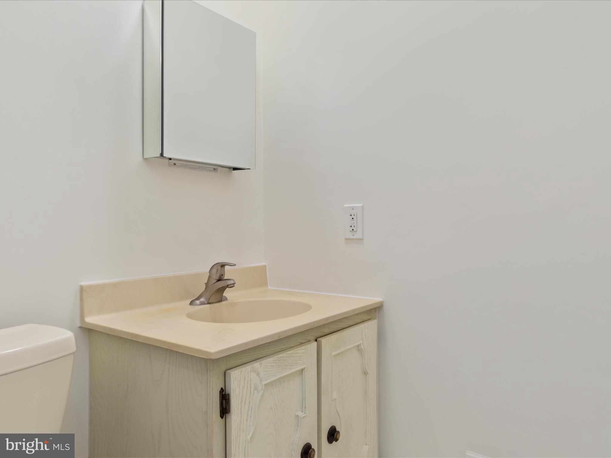 11922 Blue Spruce Road Reston, VA 20191 - Photo 33 of 65 a bathroom with a sink and a vanity